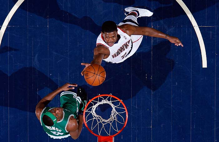 ATLANTA - JANUARY 29: Joe Johnson #2 of the Atlanta Hawks lays in a basket against Rajon Rondo #9 of the Boston Celtics at Philips Arena on January 29, 2010 in Atlanta, Georgia. NOTE TO USER: User expressly acknowledges and agrees that, by downloading and/or using this Photograph, User is consenting to the terms and conditions of the Getty Images License Agreement.   Kevin C. Cox/Getty Images/AFP== FOR NEWSPAPERS, INTERNET, TELCOS & TELEVISION USE ONLY ==