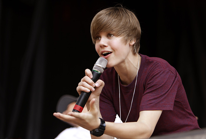FILE - In this Monday, April 5, 2010 file photo Canadian pop star Justin Bieber performs at the annual White House Easter Egg Roll in Washington, hosted by President Barack Obama. Thousands of frenzied teenagers, who spent the night camped out by Sydney Harbour, Australia, awaiting a concert from Justin Bieber, surged toward the venue Monday April 26, 2010, sending at least eight girls to the hospital and injuring several more. (AP Photo/Charles Dharapak, File)