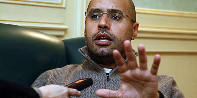 Saif al-Islam Kadhafi, son of Libyan leader Moamer Kadhafi, speaks during an interview with AFP in Tripoli on February 26, 2011 amid political turmoil and an insurrection against Kadhafi's crumbling regime. AFP PHOTO/MAHMUD TURKIA