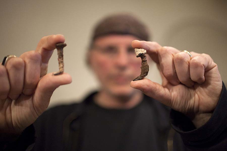 Simcha Jacobovici, the producer of Secrets Of Christianity series, shows the Roman nails which he believes may have been used in the crucifixion of Jesus, during a press conference in Jerusalem, on April 12,2011. AFP PHOTO/MENAHEM KAHANA