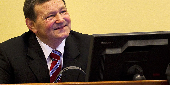 Former Croatian Army Gen. Mladen Markac, left, looks on prior to his verdict in the courtroom of the Yugoslav war crimes tribunal in The Hague, Netherlands, Friday, April 15, 2011. A U.N. court is to issue verdicts Friday in the war crimes case of three Croat generals, Ante Gotovina, Ivan Cermak and Mladen Markac, charged in the murder, mistreatment and deportation of Serbs in a 1995 military blitz known as Operation Storm. (AP Photo/Jerry Lampen, Pool)