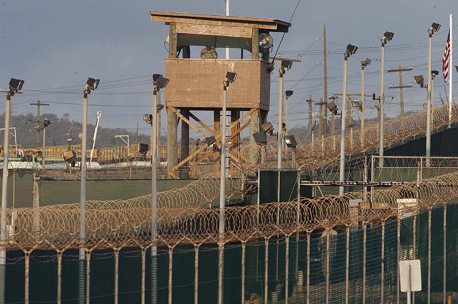 (FILES) This file photo dated March 30, 2010, reviewed by US military officials, shows a US military member manning a watch tower at Camp Delta at the US detention center in Guantanamo Bay. US President Barack Obama said on March 7, 2011 that he would lift the two-year freeze on new military trials for Guantanamo Bay terror suspects and issued new guidelines on the treatment of those held indefinitely. Obama, who has been thwarted in his desire to close the camp in Cuba which he calls a recruiting tool for Al-Qaeda, issued the long-awaited decision after a sweeping review of administration policy.    AFP PHOTO/FILES/Paul J. Richards