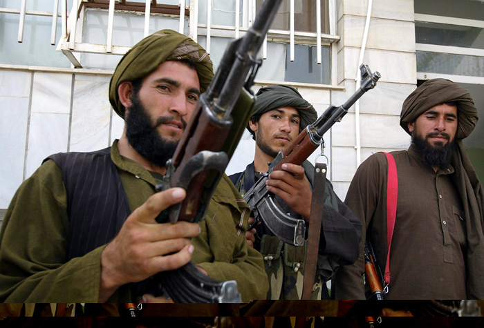 Taliban militants pose for the media after they join the Afghan government in Herat May 22, 2010. Twenty Afghan Taliban joined the Afghan government's reconciliation and reintegration programme in Herat on Saturday. REUTERS/Mohammad Shoiab (AFGHANISTAN - Tags: CIVIL UNREST POLITICS IMAGES OF THE DAY)