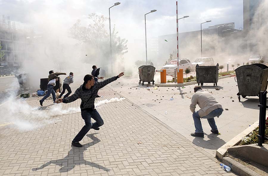 Protesters from the Self-Determination party clash with police forces during a demonstration in Pristina on May 12, 2011.  Scores of members of a Kosovo opposition party clashed with police on May 12 during a landmark visit of Serbia's chief negotiator Borko Stefanovic to Pristina to speak with the authorities.  Nine protesters from the Self-Determination party were injured when the police used force to disperse the crowd, the party said.   AFP PHOTO/ARMEND NIMANI
