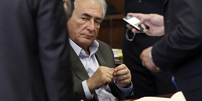 Former IMF head Dominique Strauss-Kahn (R) sits during his bail hearing at State Supreme Court, in New York, on May 19, 2011. New York State Supreme Court Judge Michael Obus said that Strauss-Kahn, 62, can be released on one million USD cash bail, and placed under 24-hour home detention with electronic monitoring -- conditions that had been proposed by his lawyers.  AFP PHOTO/POOL/Richard Drew