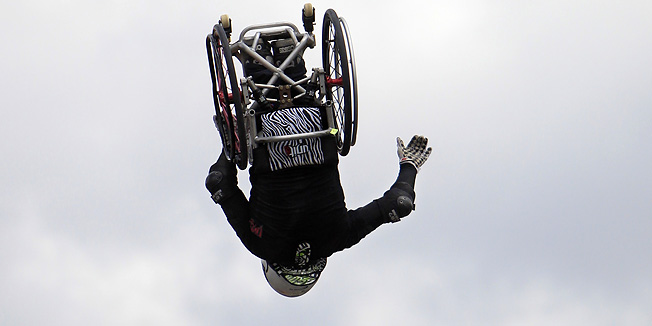 In this Sunday, May 29, 2011 photo, Aaron Fotheringham summersaults while flying through the air in his wheel chair, during practice for a Nitro Circus performance, in Pala, Calif. Fotheringham, who was born with spinal bifida, rides his chair on the 