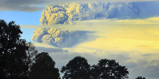 A column of smoke and ashes comes out from the Puyehue volcano, some 1,100 kilometers south of Santiago, Chile, Saturday, June 4, 2011. Authorities have evacuated about 600 people living nearby the volcano. There have been no reports of injuries. (AP Photo/Martin Iniguez)