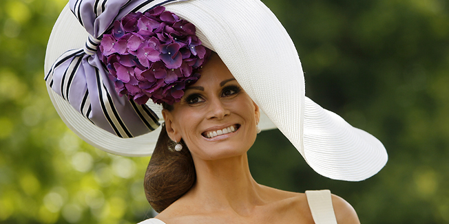 Iasbell Kristiensen wears an ornate hat on the first day of the Royal Ascot horse race meeting at Ascot, England, Tuesday, June, 14, 2011.  Ascot  is celebrating its 300 years of horse racing at the Royal Racecourse, that began with Britain's Queen Anne spotted an open heath suitable for racing, with the first race run in August 1711, with a prize of some 100 guineas. (AP Photo/Alastair Grant)