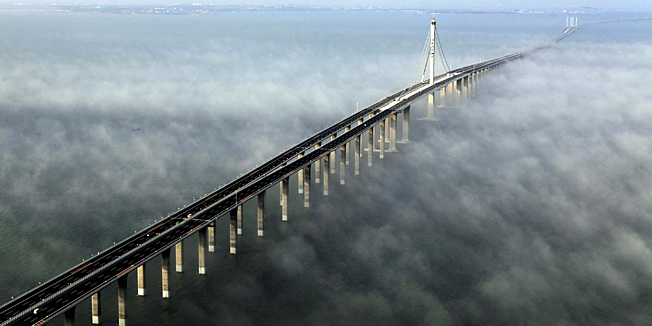 This photo taken Wednesday, June 29, 2011 released by China's Xinhua news agency shows the Jiaozhou Bay Bridge in Qingdao, east China's Shandong Province. China opened Thursday, June 30, 2011, the world's longest cross-sea bridge, which is 42 kilometers (26 miles) long and links China's eastern port city of Qingdao to an offshore island, Huangdao. (AP Photo/Xinhua, Yan Runbo) NO SALES