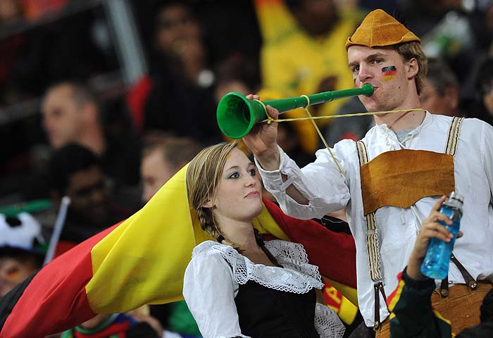 German supporters blows a vuvuzela prior to the 2010 World Cup third place match Uruguay vs Germany on July 10, 2010 at the Nelson Mandela Bay stadium in Port Elizabeth. NO PUSH TO MOBILE / MOBILE USE SOLELY WITHIN EDITORIAL ARTICLE - AFP PHOTO / FRANCK FIFE