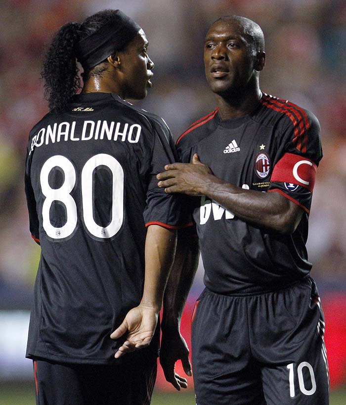 AC Milan's Ronaldinho, left, leaves as he talks to Clarence Seedorf  during the second half of an exhibition soccer match against the Chicago Fire in Bridgeview, Ill., Sunday, May 30, 2010. AC Milan won 1-0. (AP Photo/Nam Y. Huh)