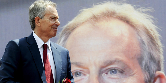 Former British Prime Minister Tony Blair arrives to address Kosovar Albanians gathering in Pristina on July 9, 2010.  Former British Prime Minister Tony Blair was welcomed as a hero during his two day visit in Kosovo as he met several children who were even named after him in the newly declared state.  AFP PHOTO/ARMEND NIMANI