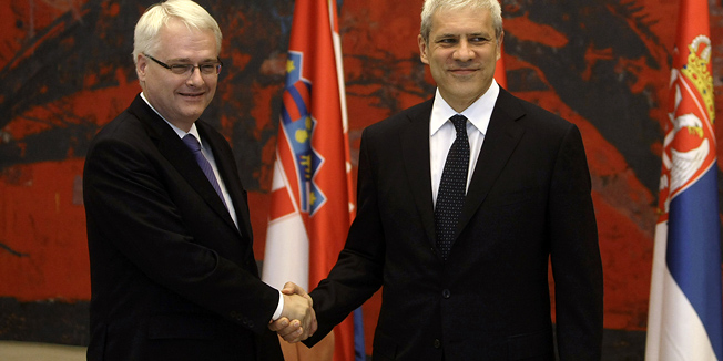 Serbian President Boris Tadic, right, and his Croatian counterpart Ivo Josipovic, shake hands prior to holding talks in Belgrade, Serbia, Sunday, July 18, 2010. Josipovic is on a two day official visit to the Serbian capital. (AP Photo/Marko Drobnjakovic)