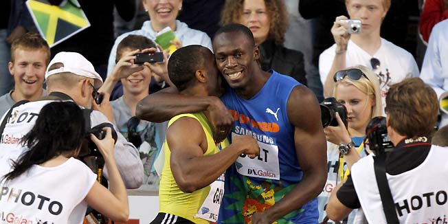 Tyson Gay of the U.S., center left, is congratulated after his victory by 2nd placed Jamaica's Usain Bolt after the men's 100m race at the IAAF Diamond League 'DN Galan' at the Stockholm Olympic Stadium in Stockholm, Sweden, August 6, 2010. (AP Photo/Niklas Larsson/SCANPIX)  **  SWEDEN OUT **
