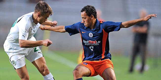 Montpellier's forward Karim Aitfana (R) vies with Gyor's defender Babic Valentin (L) during their Europa league football match Montpellier versus Gyor on August 5, 2010 at the Mosson stadium in Montpellier, southern France.  AFP PHOTO / PASCAL GUYOT