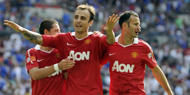 Manchester United's Dimitar Berbatov, centre, celebrates with Javier Hernandez, left, and Ryan Giggs after scoring the 3rd goal during their English FA Community Shield soccer match against Chelsea at Wembley Stadium, London, Sunday Aug. 8, 2010. (AP Photo/Tom Hevezi) ** NO INTERNET/MOBILE USEAGE WITHOUT FAPL LICENCE - SEE IPTC SPECIAL INSTRUCTIONS FIELD FOR DETAILS** 