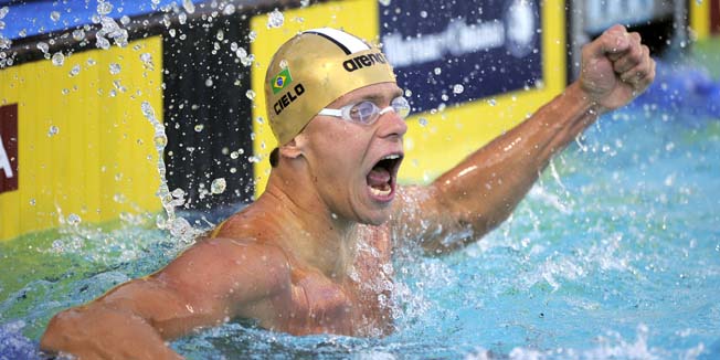 Cesar Cielo, of Brazil, celebrates after winning the men's 50-meter butterfly final at the Pan Pacific Swimming Championships, Wednesday, Aug. 18, 2010, in Irvine, Calif.  (AP Photo/Mark J. Terrill)