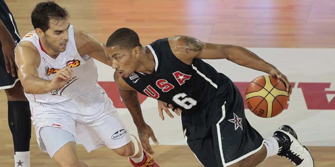United States' Derrick Rose, right, drives with the ball past Spain's Jose Manuel Calderon during a friendly basketball game in Madrid on Sunday, Aug. 22, 2010. (AP Photo/Arturo Rodriguez)
