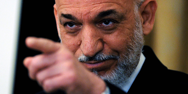 Afghan President Hamid Karzai gestures during a press conference at the Presidential Palace in Kabul on July 29, 2010. Afghan President Karzai on Thursday condemned as 