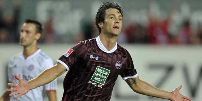 RESTRICTIONS / EMBARGO - ONLINE CLIENTS MAY USE UP TO SIX IMAGES DURING EACH MATCH WITHOUT THE AUTHORISATION OF THE DFL. NO MOBILE USE DURING THE MATCH AND FOR A FURTHER TWO HOURS AFTERWARDS IS PERMITTED WITHOUT THE AUTHORISATION OF THE DFL.Kaiserslautern's Srdjan Lakic celebrates scoring during the German first division Bundesliga football match between FC Kaiserslautern and FC Bayern Munich at the Fritz-Walter stadium in Kaiserslautern, southwestern Germany, on August 27, 2010.     AFP PHOTO / THOMAS KIENZLE