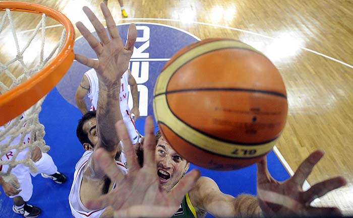 ** CORRECTS NAME ** Brazil's Tiago Splitter, right, puts up a shot as Iran's Hamed Hadadi defends during the preliminary round of the World Basketball Championship, Saturday, Aug. 28, 2010, in Istanbul, Turkey.  (AP Photo/Mark J. Terrill)