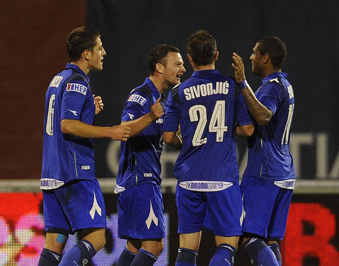 Zagreb, 290810.Prva HNL liga, 6. kolo izmedju Dinama i Cibalie.Na slici: igraci Dinama Ademi, Sivonjic, Sammir i strijelac Tomecak slave nakon gola.Foto: Drago Sopta / CROPIX