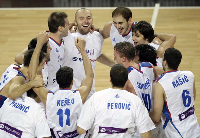 Serbia's players celebrate after winning their World Basketball Championship quarter-final match against Spain, in Istanbul, Turkey, Wednesday, Sept. 8, 2010. (AP Photo/Ibrahim Usta)