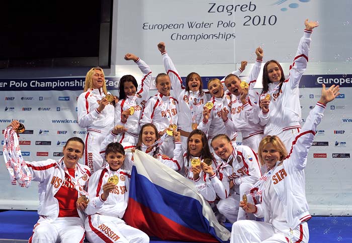 Russian players cheer on the podium as they celebrate their gold medal victory against Greece at the European Water Polo Championship finals at the Mladost venue swimming pool in Zagreb, Croatia on September 10, 2010. Russia won the gold medal by beating Greece 11-6.  AFP PHOTO / ATTILA KISBENEDEK