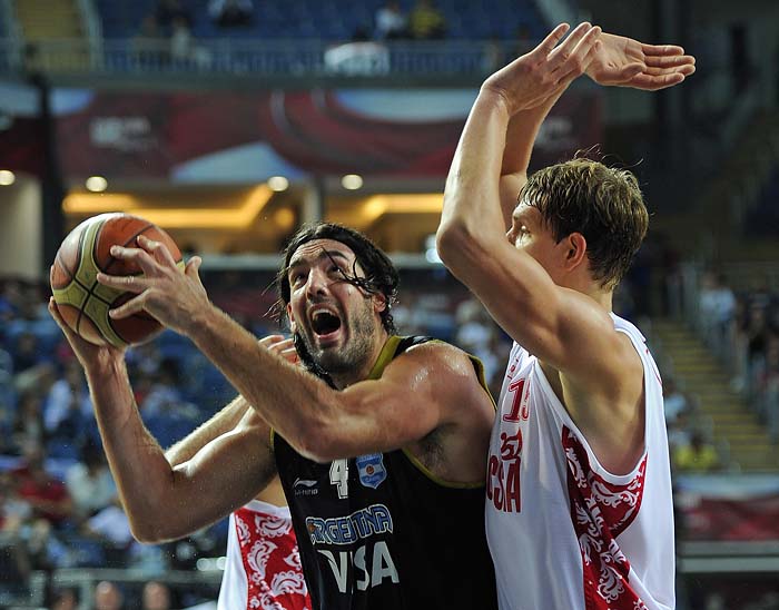 Argentina's Luis Scola, left, attempts to get past Russia's Timofey Mozgov during a playoff  to determine who goes to the 5th-8th place round at the World Basketball Championship, Friday, Sept. 10, 2010, in Istanbul, Turkey.   (AP Photo/Mark J. Terrill)