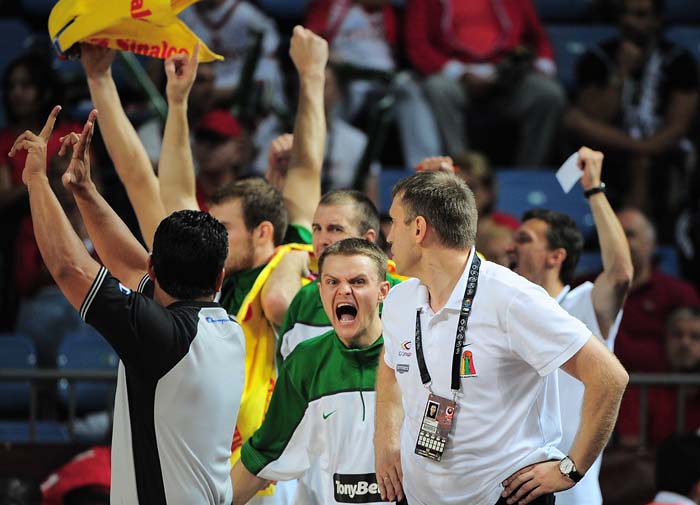 Lithuanian players celebrate a point during a World Cup Championship basketball match Serbia versus Lithuania for third place in Istanbul on September 12, 2010. AFP PHOTO / FRANCK FIFE