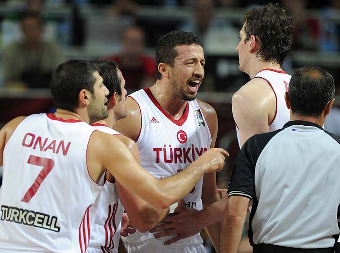 Turkey's Hidayet Turkoglu, center, and Omer Onan react during the final of the World Basketball Championship between Turkey and the USA, Sunday, Sept. 12, 2010, in Istanbul.  (AP Photo/Mark J. Terrill)