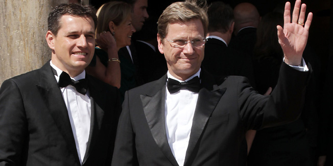 FILES - Picture taken on July 25, 2010 shows German Foreign Minister Guido Westerwelle and his partner Michael Mronz posing for photographers at the 'Festspielhaus' ahead of the opening performance of 'Lohengrin' at the Richard Wagner opera festival in the southern German city of Bayreuth. Westerwelle has 