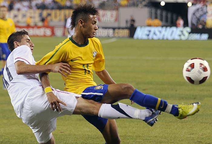 Brazil forward Neymar, right, holds off U.S. midfielder Alejandro Bedoya during the first half of an exhibition soccer match Tuesday, Aug. 10, 2010, at New Meadowands Stadium in East Rutherford, N.J. Brazil won 2-0. (AP Photo/Bill Kostroun) 