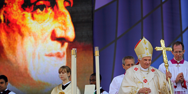 Pope Benedict XVI (2nd R) addresses a mass to beatify Cardinal John Henry Newman, (Pictured background left) in Cofton Park, in Birmingham, central England, on September 19, 2010. Pope Benedict XVI's state visit to Britain has been a 