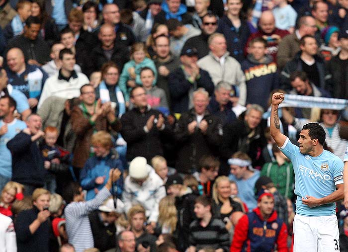 Manchester City's Carlos Tevez celebrates his goal during their English Premier League soccer match against Chelsea at The City of Manchester Stadium, Manchester, England, Saturday, Sept. 25, 2010. (AP Photo/Scott Heppell) ** NO INTERNET/MOBILE USAGE WITHOUT FOOTBALL ASSOCIATION PREMIER LEAGUE(FAPL)LICENCE. CALL +44 (0) 20 7864 9121 or EMAIL info@football-dataco.com FOR DETAILS **