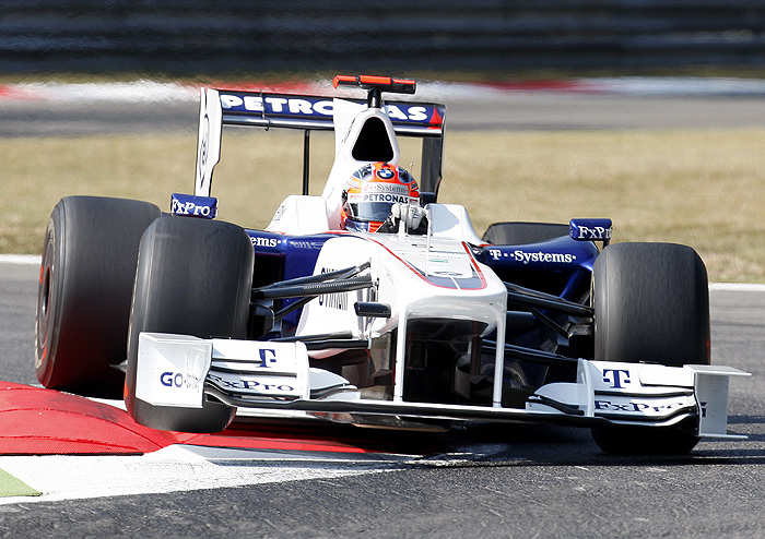 FILE - In this Sept. 11, 2009 file photo, Robert Kubica, of Poland, steers his BMW Sauber during the first free practice session for the Italian Formula one Grand Prix, in Monza, Italy. German car maker BMW has agreed to sell its Formula One team to previous owner Peter Sauber, provided the team gets a place on the grid next season. BMW announced in July that it would pull out of Formula One at the end of the season, citing the global economic downturn. The company said Friday Nov. 27, 2009, that a previous agreement to sell the team to Qadbak Investments has been annulled. (AP Photo/Antonio Calanni)
