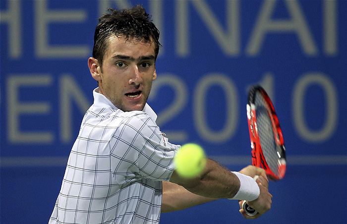 Croatia's Marin Cilic hits a shot against Serbia's Janko Tipsarevic in a singles quarter final match at the Chennai Open Tennis Championship in Chennai, India, Saturday, Jan. 9, 2010. Cilic won 6-1, 6-3. (AP Photo)