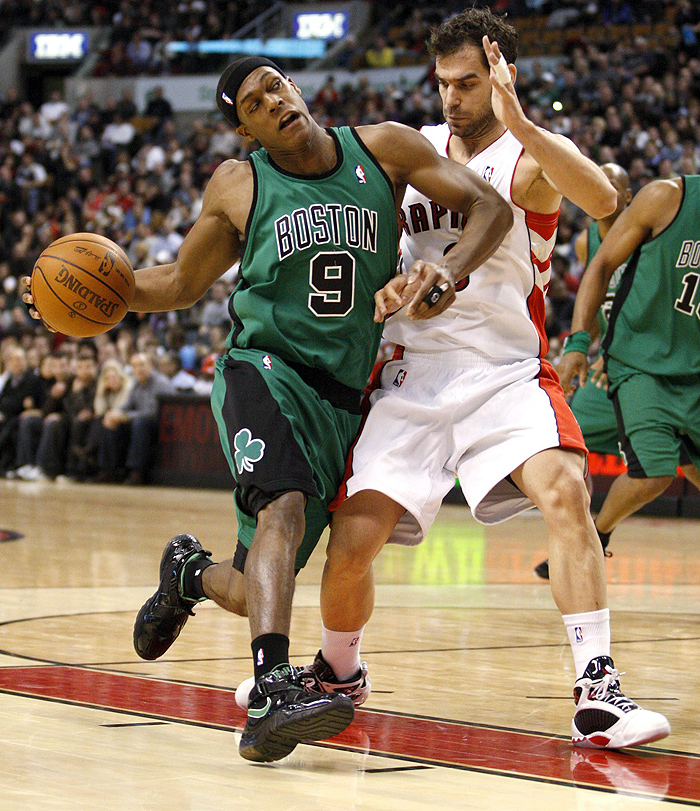 Boston Celtics guard Rajon Rondo drives to the basket against Toronto Raptors guard Jose Calderon (R) of Spain during the first half of their NBA basketball game in Toronto January 10, 2010.   REUTERS/ Mike Cassese   (CANADA - Tags: SPORT BASKETBALL)