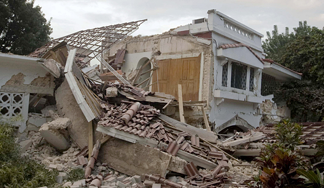 A destroyed building near the Hotel Villa Creole in Port-au-Prince is seen on Tuesday, Jan. 12, 2010 after the strongest earthquake in more than 200 years struck Haiti. (AP Photo/The Canadian Press, Montreal La Presse, Ivanoh Demers)