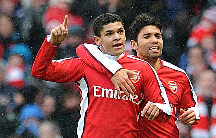 Arsenal's Neves Denilson, left, celebrates scoring against Everton with teammate Eduardo during the English Premier League soccer match at The Emirates, London, Saturday Jan. 9, 2010. The match ended in a 2-2 draw. (AP Photo/PAA, Anthony Devlin) ** UNITED KINGDOM OUT NO SALES NO ARCHIVE - NO INTERNET/MOBILE USAGE WITHOUT FAPL LICENCE - SEE IPTC SPECIAL INSTRUCTIONS FIELD FOR DETAILS **