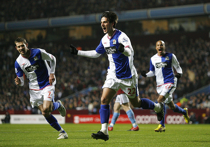 Blackburn Rovers Croatian player Nikola Kalinic (C) celebrates scoring his goal against Aston Villa during the league cup semi final second leg football match at Villa Park in Birmingham, West Midlands, England on Janauary 20, 2010. AFP PHOTO/IAN KINGTONFOR EDITORIAL USE ONLY Additional licence required for any commercial/promotional use or use on TV or internet (except identical online version of newspaper) of Premier League/Football League photos. Tel DataCo +44 207 2981656. Do not alter/modify photo.