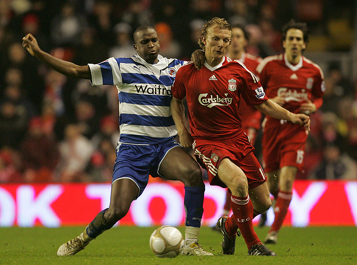 Liverpool's Dirk Kuyt, right, vies for the ball against Reading's Kalifa Cisse during their third round FA Cup soccer replay at Anfield, Liverpool, England, Wednesday Jan. 13, 2010. (AP Photo/Tim Hales) ** NO INTERNET/MOBILE USAGE WITHOUT FOOTBALL ASSOCIATION PREMIER LEAGUE (FAPL) LICENCE. CALL +44 (0) 20 7864 9121 or EMAIL info@football-dataco.com FOR DETAILS **
