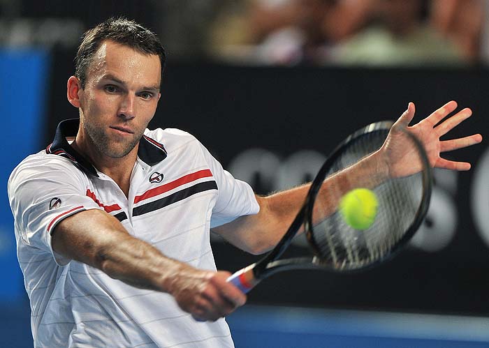 Croatian tennis player Ivo Karlovic plays a backhand return during his men's singles match against compatriot Ivan Ljubicic on the fifth day of play at the Australian Open tennis tournament in Melbourne on January 22, 2010.   The Australian Open is taking place from January 18-31.   AFP PHOTO/Paul CROCK