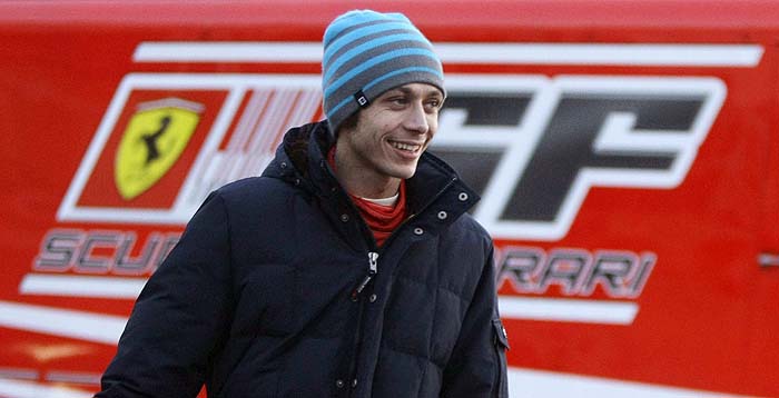 MotoGP world champion Valentino Rossi walks by the paddock during a F1 Ferrari testing session at Catalunya's racetrack in Montmelo, near Barcelona January 21, 2010. REUTERS/Albert Gea (SPAIN - Tags: SPORT MOTOR RACING)