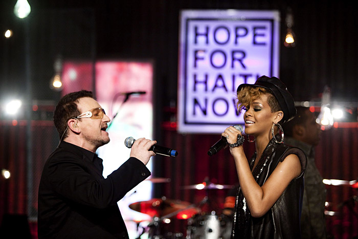 Singers Bono and Rihanna perform during the 
