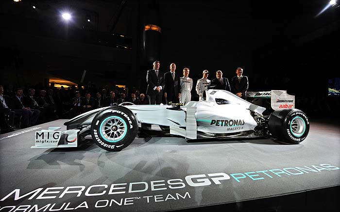 (From L) British manager Ross Brawn, Daimler CEO Dieter Zetsche, German driver Nico Rosberg, German seven-time world champion Michael Schumacher, Mercedes motor sports director German Norbert Haug and British manager Nick Fry pose during the presentation of the new Mercedes GP Petronas Formula 1 team, at the Mercedes Museum in Stuttgart, southern Germany, on January 25, 2010. Having retired in 2006, the 41-year-old broke his three-year hiatus to sign a three-year contract to race for Mercedes GP and reunite with Ross Brawn, the man who orchestrated all of his world drivers' championship titles.    AFP PHOTO / Patrick HERTZOG