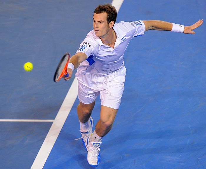 British tennis player Andy Murray plays a backhand return during his men's singles quarter-final match against Spanish oppponent Rafael Nadal on day nine at the Australian Open tennis tournament in Melbourne on January 26, 2010.   The Australian Open is taking place from January 18-31.  AFP PHOTO/William WEST