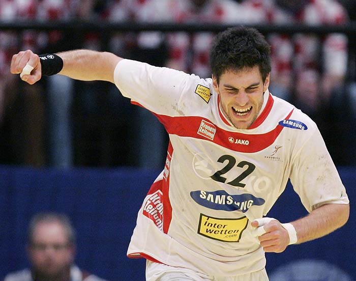 Austria's Markus Wagesreiter reacts after scoring against Croatia during their Men's European Handball Championship second round match in Vienna January 26, 2010. REUTERS/Nikola Solic    (AUSTRIA - Tags: SPORT HANDBALL)