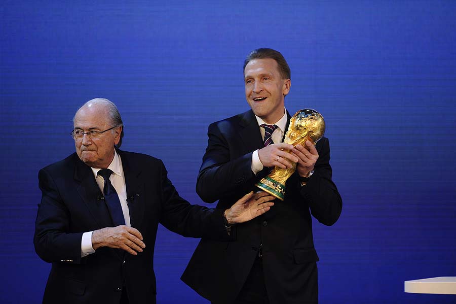 Fifa President Sepp Blatter hands over the World Cup trophy to Russia's minister of Sports, Tourism and Youth Policy Vitaly Mutko (R) after the official announcement that Russia will host the 2018 World Cup on December 2, 2010 at the FIFA headquarters in Zurich.