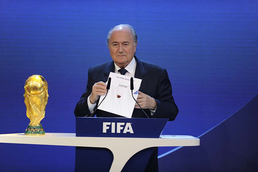 FIFA President Sepp Blatter holds up the name of Qatar during the official announcement of the 2022 World Cup host country on December 2, 2010  at the FIFA headquarters in Zurich. South Korea, Japan, Australia, Qater and the US were all bidding to host the 2022 World Cup.